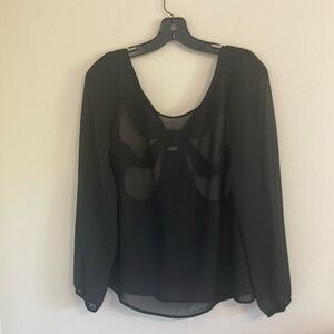 Sheer black long sleeve shirt with bow cutout in back of shirt